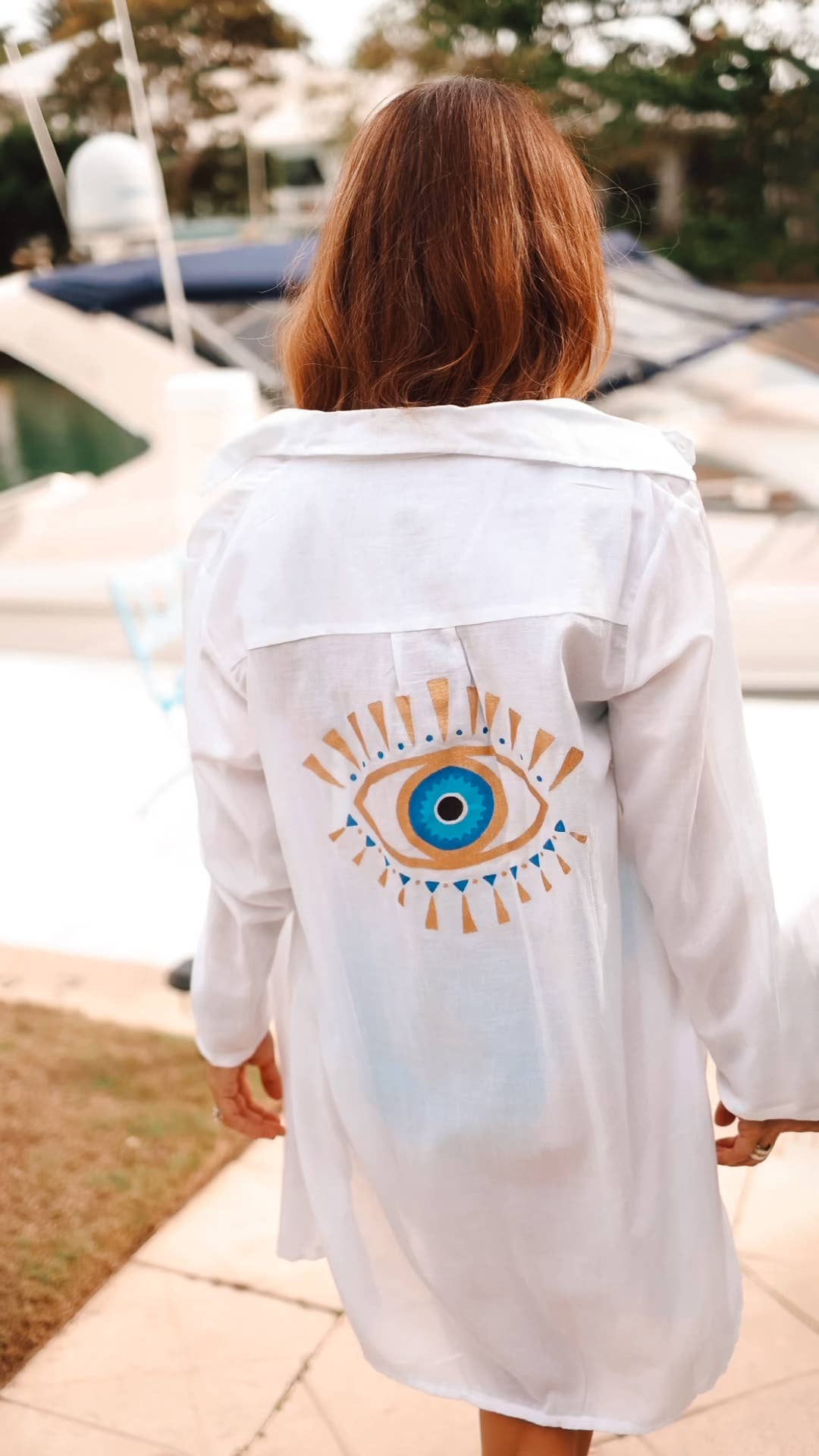 evil eye shirt dress Chic White Shirt Dress with Evil Eye Detail A perfect mix of minimal style and statement fashion. Custom-made outfit for effortless summer and vacation looks. #EvilEyeDress #WhiteShirtDress #ResortStyle #CustomMadeOutfit #VacationLook {