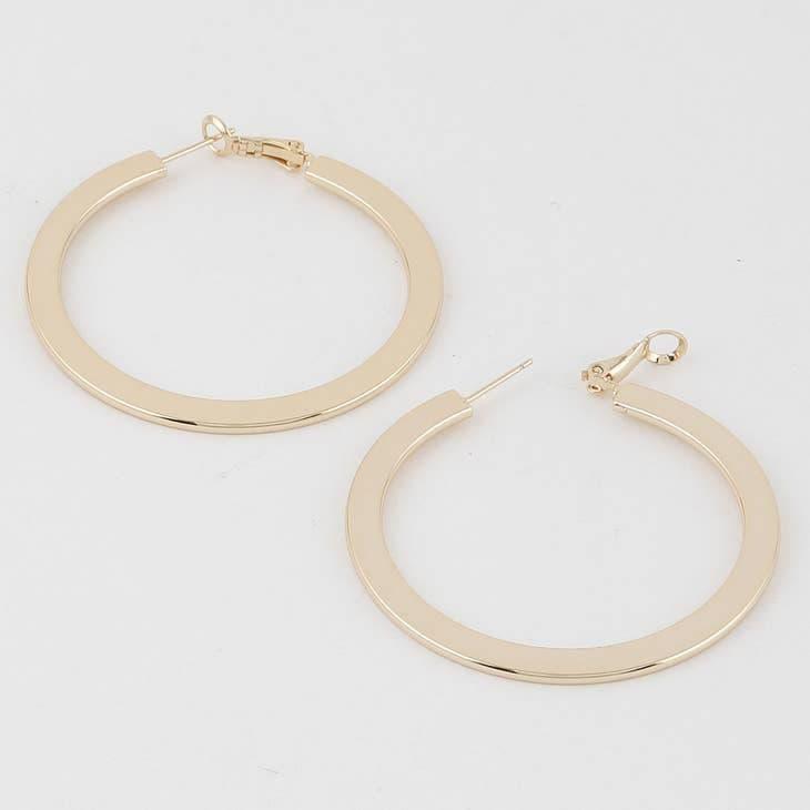pair of flat hoop earrings in gold with latch back closure