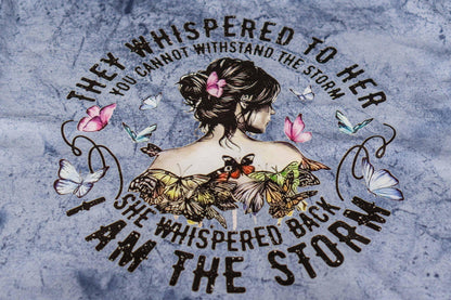She is the Storm Graphic T-Shirt.